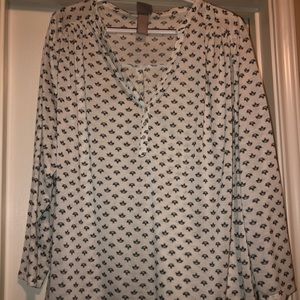 White patterned blouse.